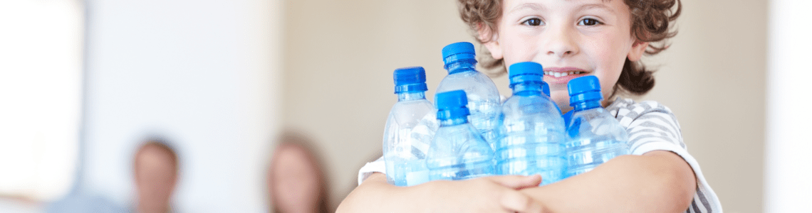 kid with the empty bottles 